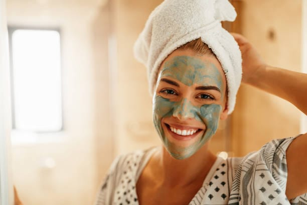 Natural Homemade Face Masks, istockphoto. Portrait of an attractive young woman standing in the bathroom with a facial mask
